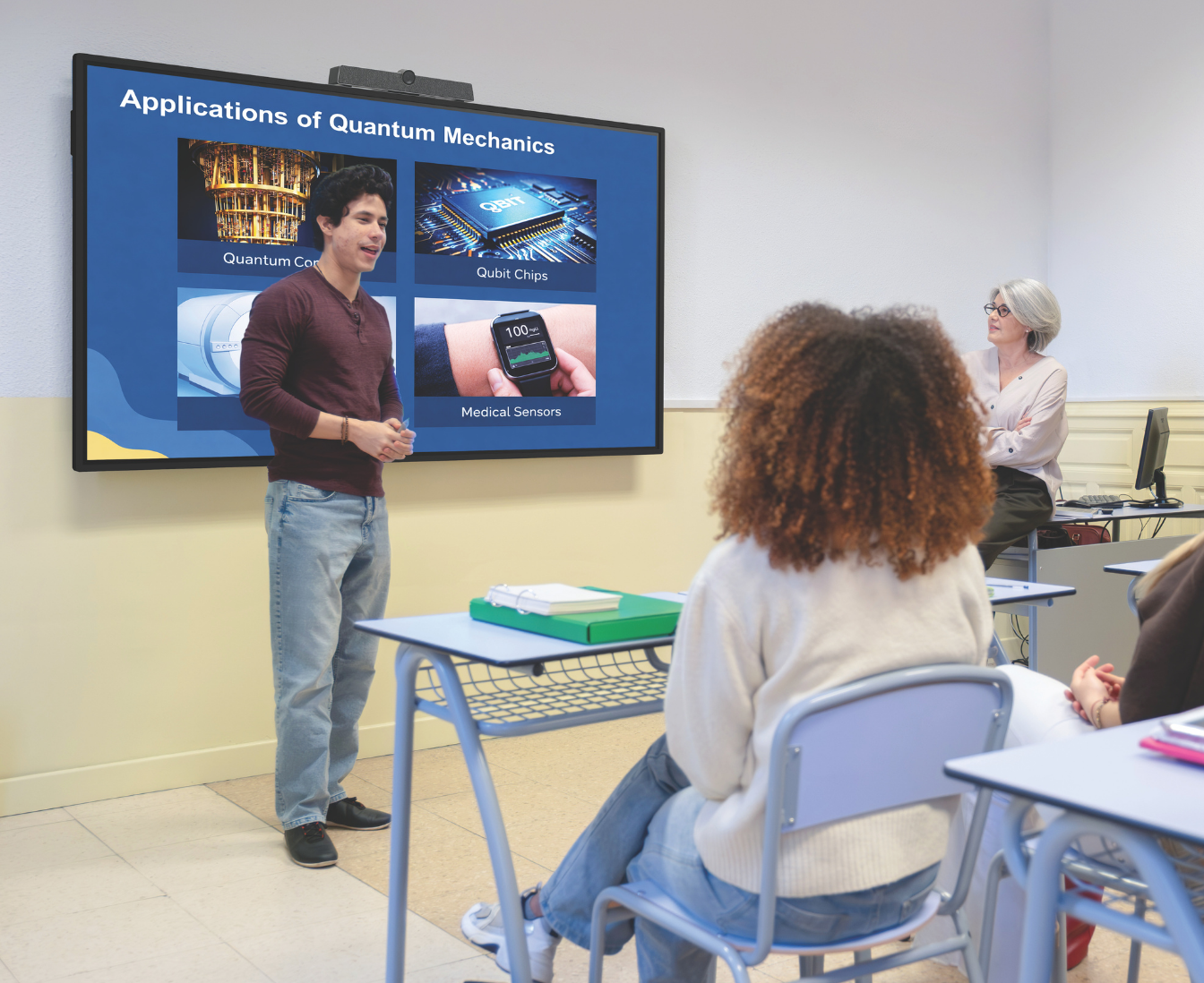 touch screen in a classroom with teacher at the front