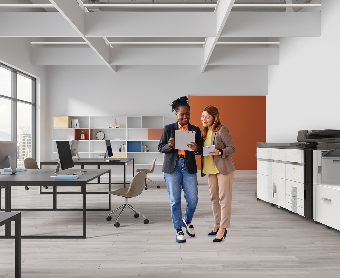 printer with two people walking by